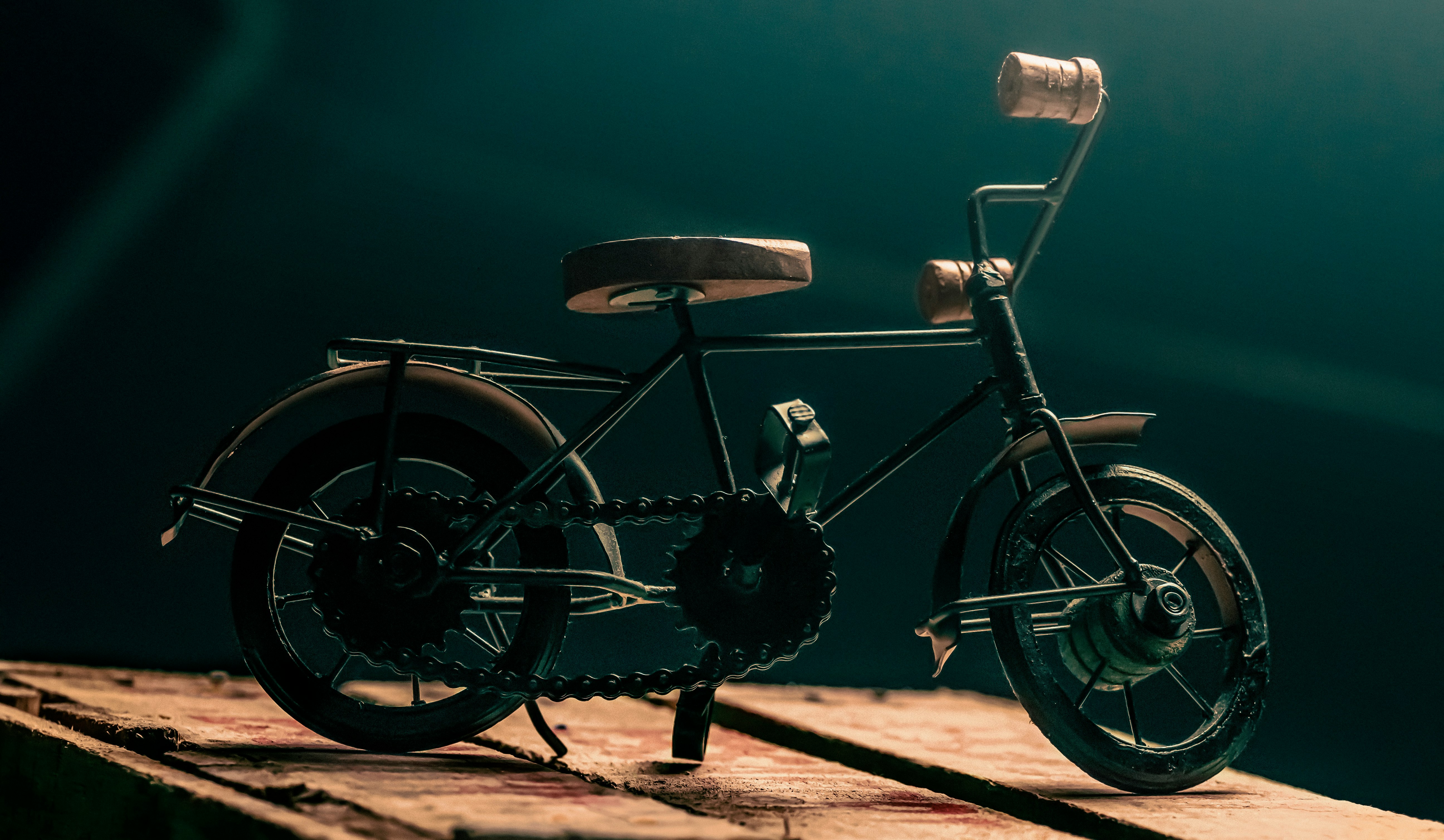 black city bike on brown sand during daytime